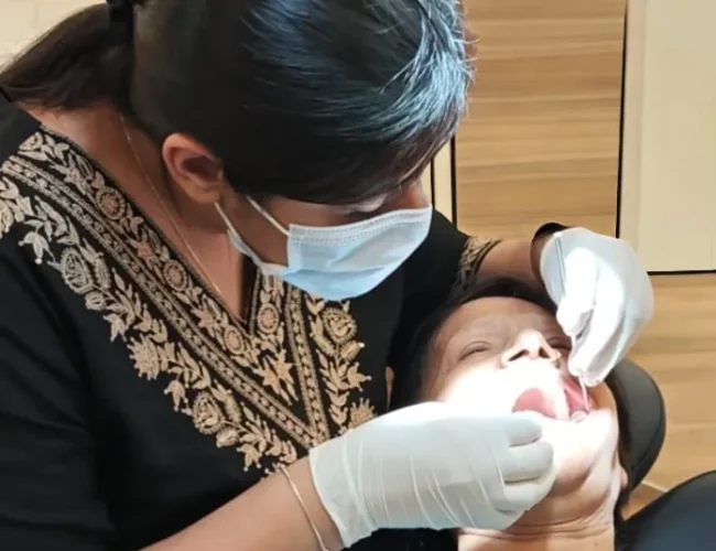 Dr. Shreya, a top root canal specialist is performing Dental Examinations & Preventive Dentistry